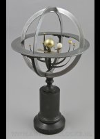 French mid-19th Century Planetarium, Armillary Sphere, Sphre Armillaire, Orrery

A mid-19th Century planetarium, unsigned but in the style of Charles Dien, diameter centre sunball is 3.0 cm. Has six small  ivory planetballs on separate arms revolving around it and an ivory earthball geared mechanism with ivory moonball. Stamped metal meridian circle and horizon ring (diameter 22.5 cm), raised on a turned ebonised column and plinth base. 38 cm  high.

Horisontal ring has indication of the months with 10 day indication, zodiac indication by day. Other ring has stamped EQUINOXES and SOLSTICES<BR/>orrery, armillary sphere, armillaire sphere
Other names for this item are: orrery, armillary sphere, armillaire sphere