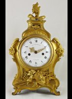 Gilded brass casted french clock with verge movement, signed on dial and movement 'G.J. Champion  Paris'. Original gilding.