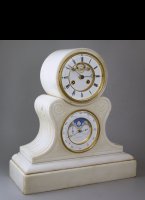 White marble mantel clock with visible 'Brocot'-escapement. Below is an everlasting calendar with moon-, month-, day- date- and equation-indication. The calendar automatically jumps from 28, 29, 30 or 31 to 1, depending the length of the month (February 28>1, leap-years 29>1). De central hand shows the month and the equation correction.
Going for about 20 days.
dimentions: wide 37 cm, deep 17 cm, high 41 cm, weight 18 kg