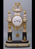 Case: white and black marble and gilt bronze, portal-shaped, rectangular, white marble base with rounded corners, three firegilt feet, gilt flower applications, white and black marble half-columns with applied acanthus, crowned by 2 vases, the clock movement in the centre decorated by a festoon and a cord, crowned by a vase with rose decoration, firegilt, glazed, ornamented brass bezel. Dial: enamel, outer Arabic hours 
