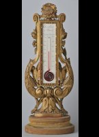 Guilded wooden stand with silvered engraved brass plate. Temperature in Reaumur and Celsius. Height 31cm,
