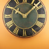 Antique dial of tower clock with gilded hands and working.