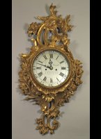 Wooden carved and gilded english wall clock by Joshua Henlett, Bristol.
