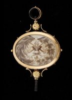 Large gold pocket watch key with a mourning sceen in hair of a deceased person on both sides.

dimensions: 61 x 39 mm