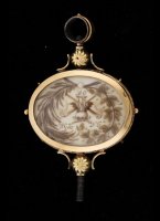 Large gold pocket watch key with a mourning sceen in hair of a deceased person on both sides.

dimensions: 61 x 39 mm