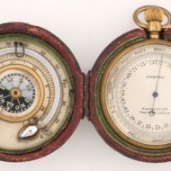 Pocket altimeter with thermometer and compass in box.