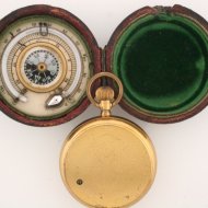 Pocket altimeter with thermometer and compass in box.