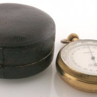 Pocket altimeter with thermometer and compass in box.