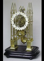 English skeleton mantel clock under a dome, signed 'J. Needs, Exmouth, Clerk Enwell'