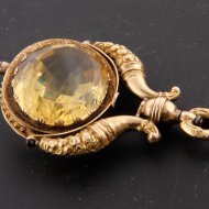 golden pocket watch key with citrine
