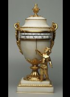 Mini white marble cercle-tournant mantel clock.