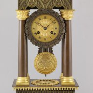 Brass casted french portico mantel clock in gothic style.