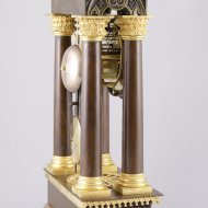 Brass casted french portico mantel clock in gothic style.