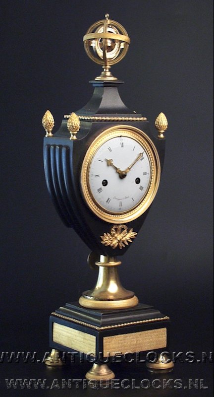 Guilded and patinated vase shaped empire clock