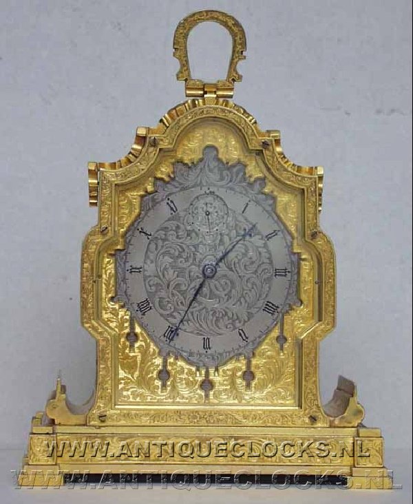 Fully engraved and gilded Strut clock with seconds hand. ca 1860